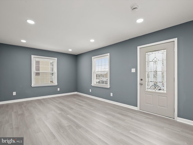 foyer entrance with light hardwood / wood-style floors