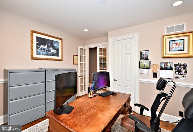 office space with hardwood / wood-style floors