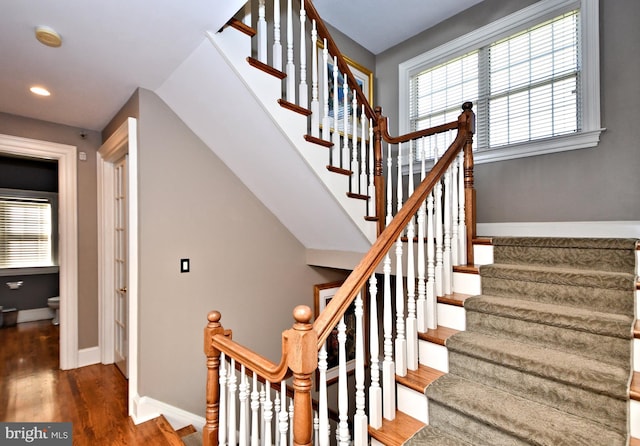 stairs with wood-type flooring