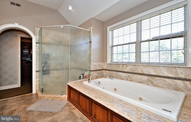 bathroom with plus walk in shower and vaulted ceiling