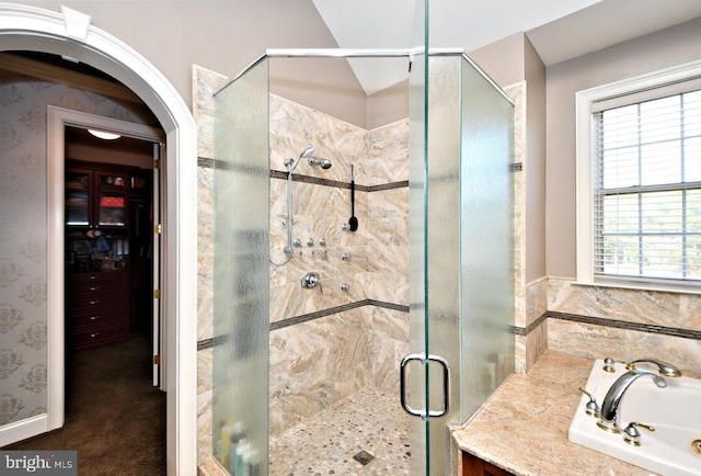 bathroom featuring sink and plus walk in shower