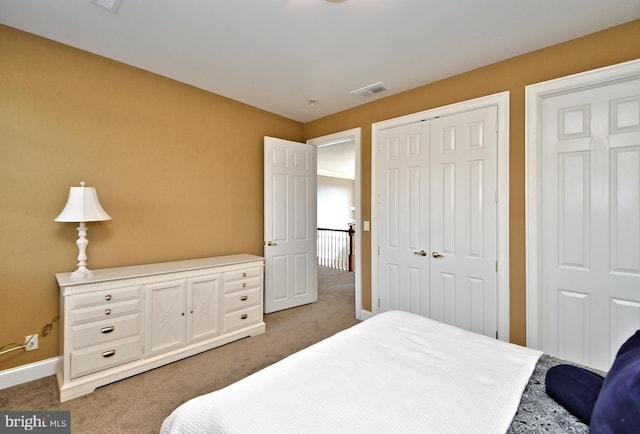 carpeted bedroom with a closet