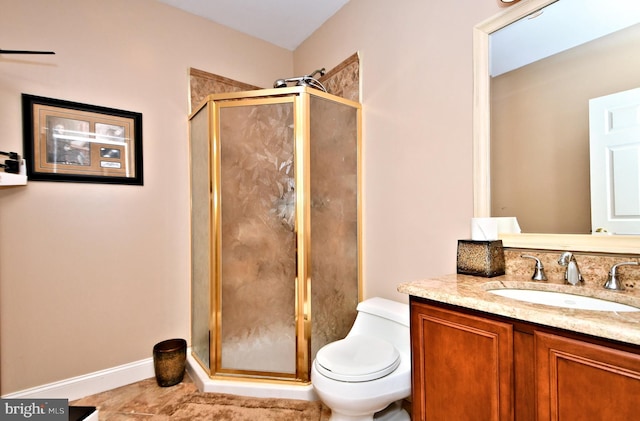 bathroom with walk in shower, vanity, and toilet