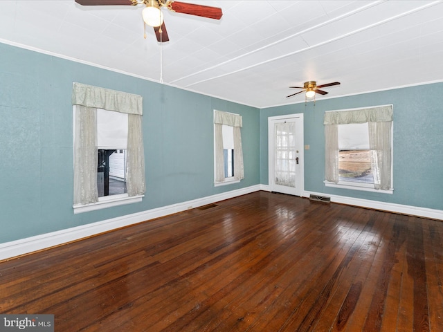 spare room featuring hardwood / wood-style flooring, crown molding, and ceiling fan