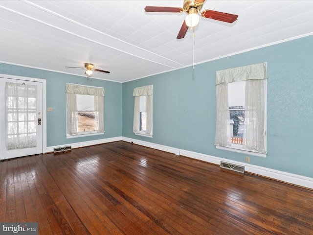 spare room with wood-type flooring, ornamental molding, and ceiling fan