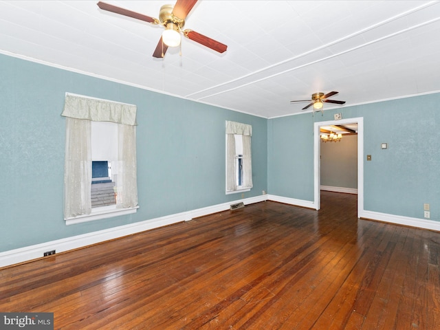 spare room featuring hardwood / wood-style floors, ornamental molding, and ceiling fan