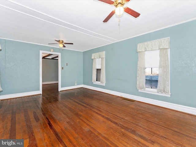 spare room featuring crown molding, ceiling fan, and wood-type flooring