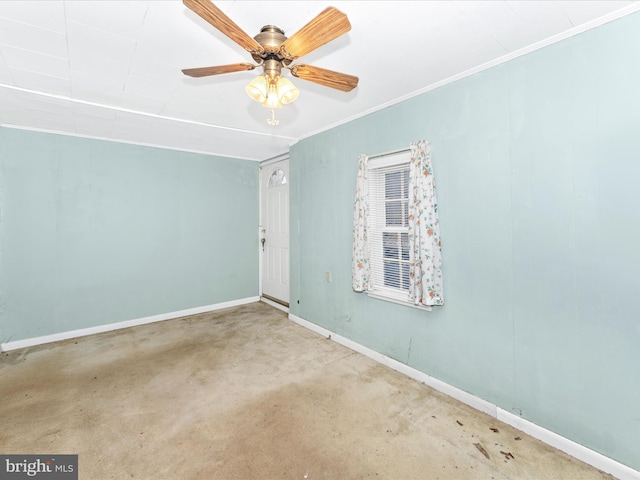 spare room with crown molding and ceiling fan