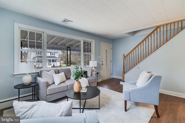 living room featuring dark hardwood / wood-style flooring and baseboard heating