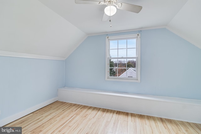 additional living space featuring ceiling fan, lofted ceiling, and light hardwood / wood-style floors