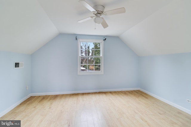 additional living space with ceiling fan, lofted ceiling, and light hardwood / wood-style floors