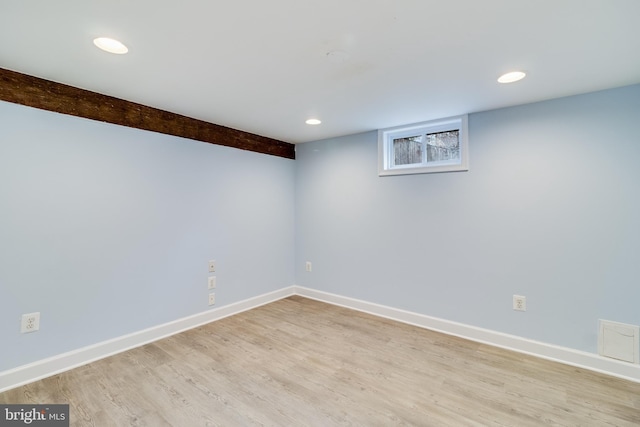 basement featuring light wood-type flooring