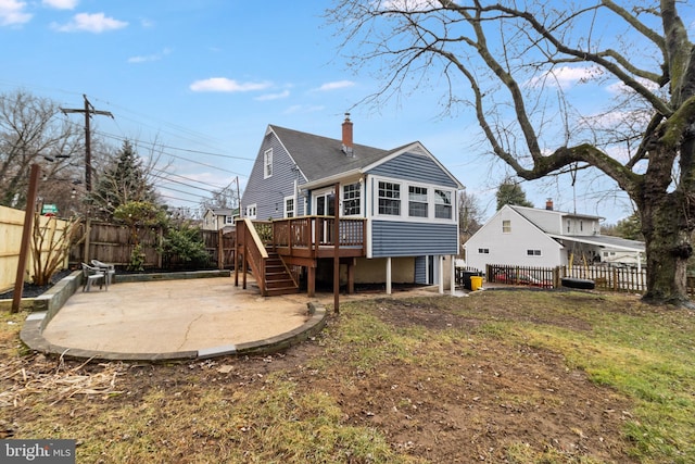 rear view of property with a patio and a deck