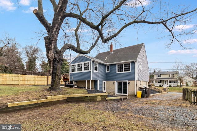 back of property with a wooden deck