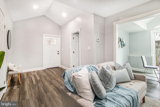 living room featuring vaulted ceiling and dark hardwood / wood-style floors