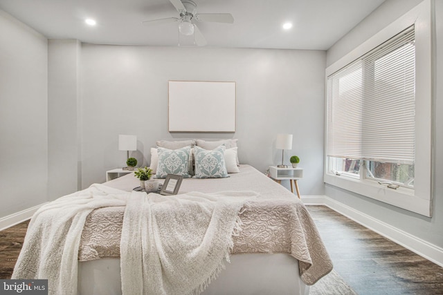 bedroom featuring ceiling fan and dark hardwood / wood-style flooring