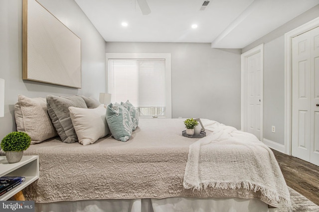 bedroom featuring hardwood / wood-style flooring and ceiling fan