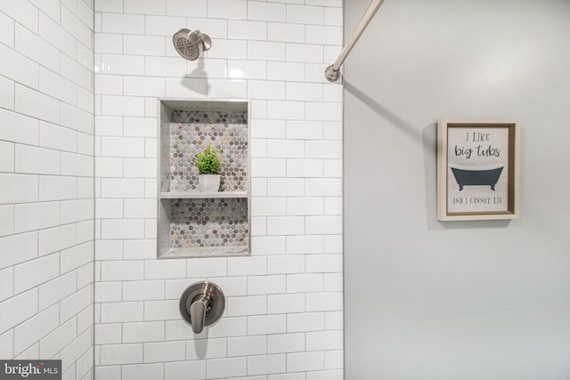 bathroom with tiled shower