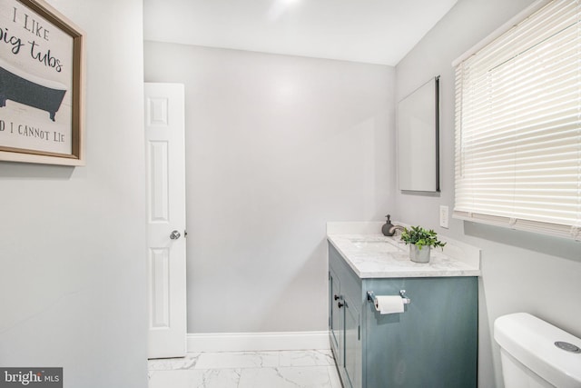 bathroom featuring vanity and toilet