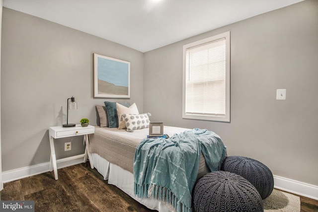 bedroom featuring dark wood-type flooring