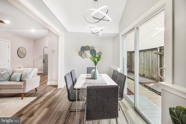 dining space with an inviting chandelier and wood-type flooring