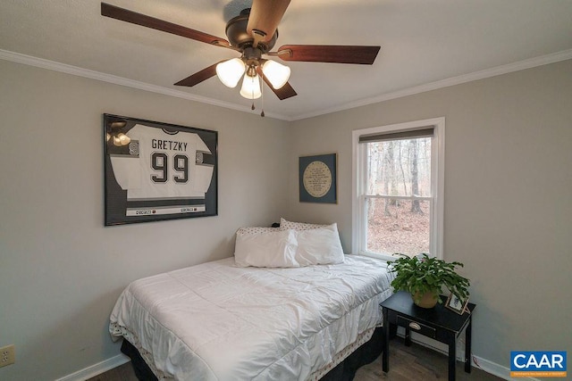 bedroom with ceiling fan and ornamental molding