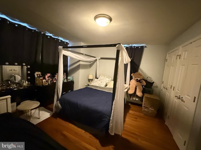 bedroom with wood finished floors