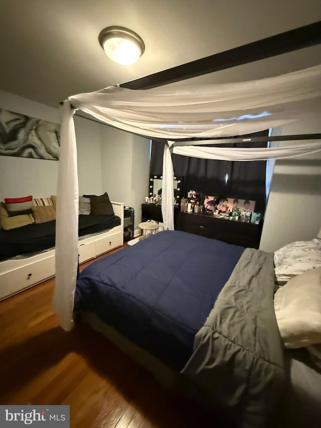 bedroom featuring wood finished floors