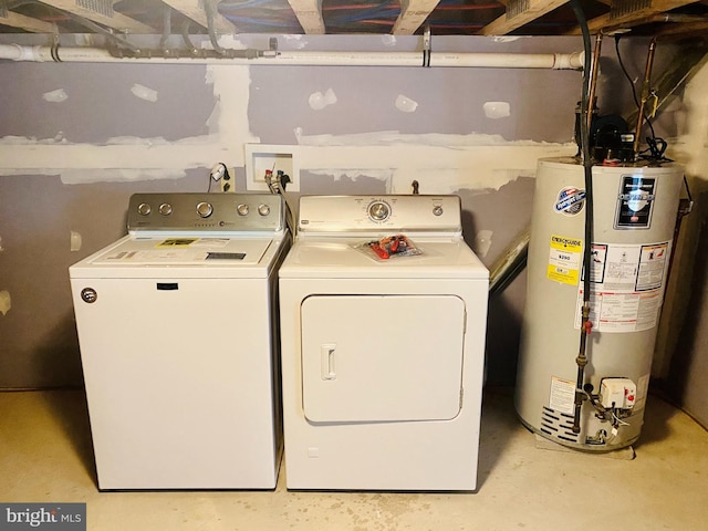 laundry room featuring washer and dryer, laundry area, and water heater