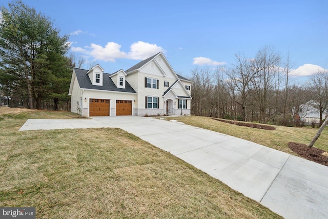 view of front of house featuring a garage and a front yard