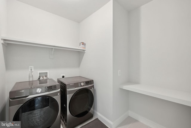 laundry area with washing machine and dryer