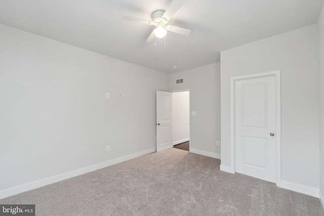 unfurnished bedroom with carpet floors and ceiling fan