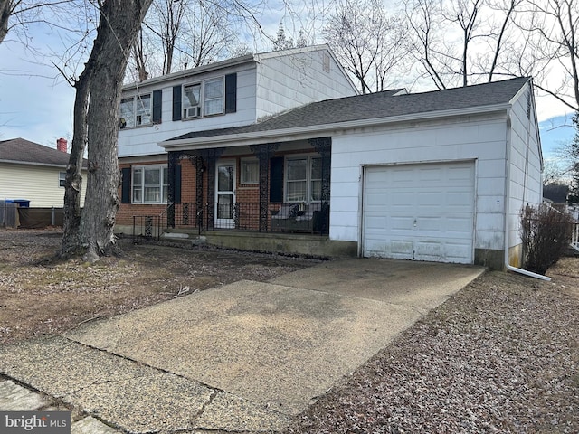 view of front of house featuring a porch and a garage