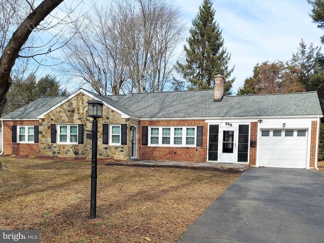 single story home with a garage and a front yard