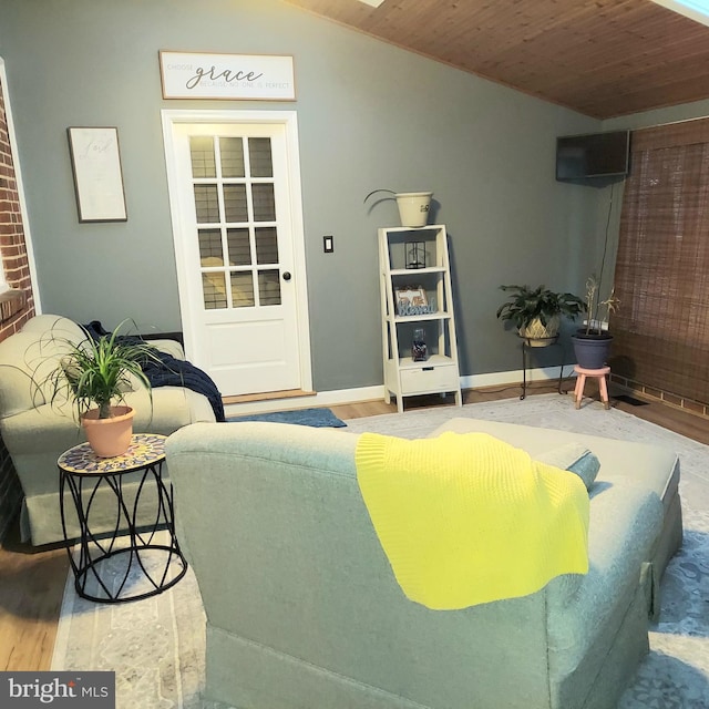 living room featuring wood-type flooring, vaulted ceiling, and wooden ceiling