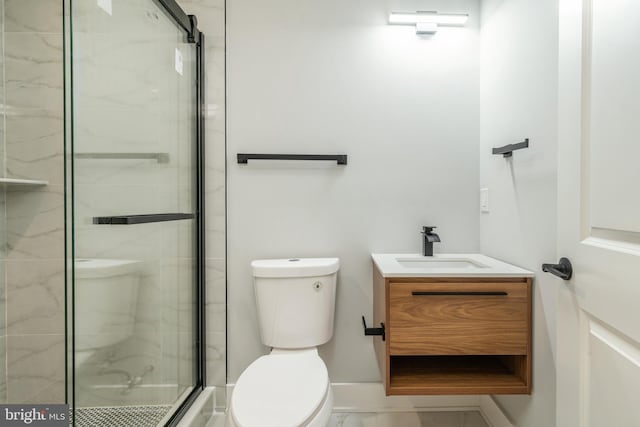 full bath featuring marble finish floor, toilet, a shower stall, vanity, and baseboards