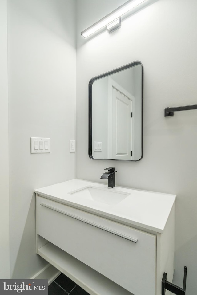 bathroom with tile patterned floors and vanity