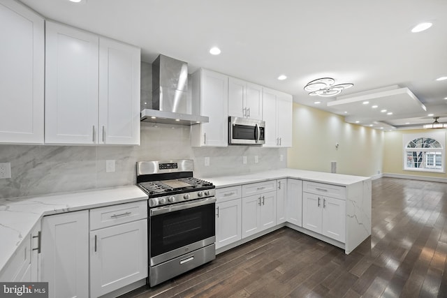 718 Collington Ave, Baltimore, MD 21205 - kitchen featuring appliances with stainless steel finishes, wall chimney range hood, and white cabinets