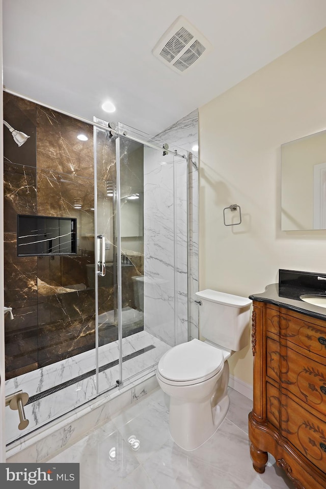 718 Collington Ave, Baltimore, MD 21205 - bathroom featuring vanity, toilet, and a shower with door