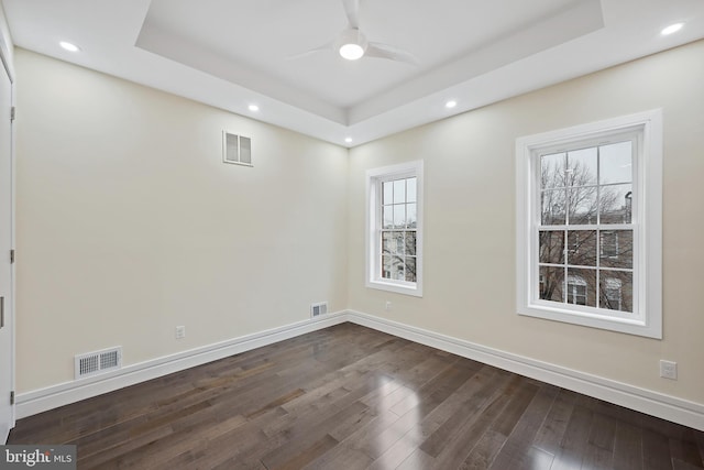 718 Collington Ave, Baltimore, MD 21205 - empty room with a raised ceiling, dark wood-type flooring, and ceiling fan