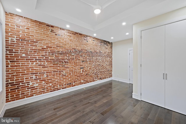 718 Collington Ave, Baltimore, MD 21205 - interior space with brick wall, dark hardwood / wood-style floors, and a tray ceiling