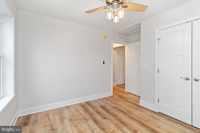 unfurnished bedroom featuring a closet, ceiling fan, and light hardwood / wood-style flooring