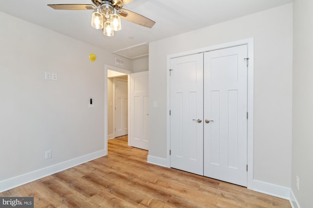 unfurnished bedroom featuring ceiling fan, light hardwood / wood-style floors, and a closet