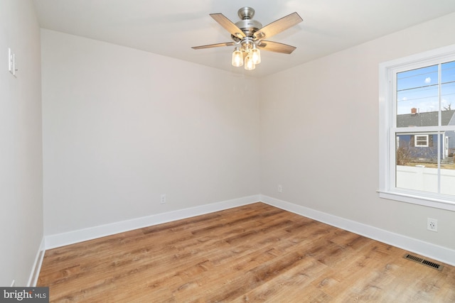 unfurnished room featuring hardwood / wood-style flooring and ceiling fan