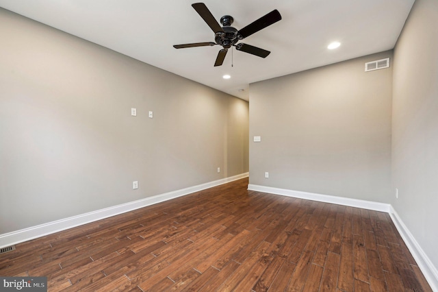 unfurnished room with dark wood-type flooring and ceiling fan