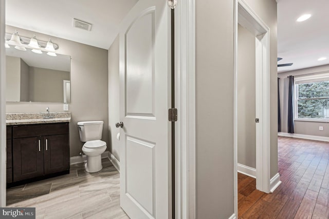 bathroom with vanity and toilet