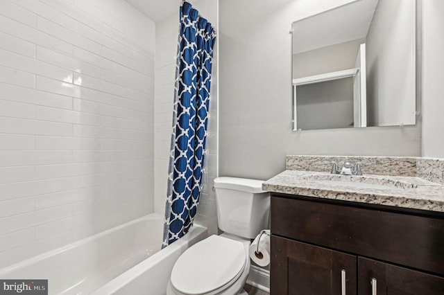 full bathroom with vanity, shower / bath combo, and toilet