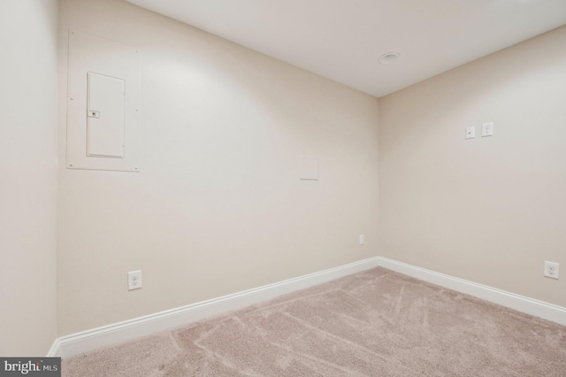 carpeted empty room featuring electric panel