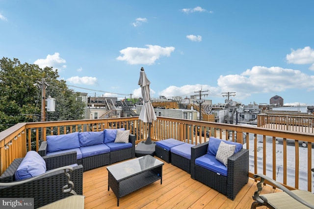 wooden deck featuring an outdoor hangout area