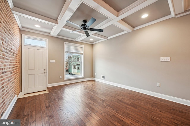 entrance foyer featuring brick wall, coffered ceiling, hardwood / wood-style floors, and ceiling fan